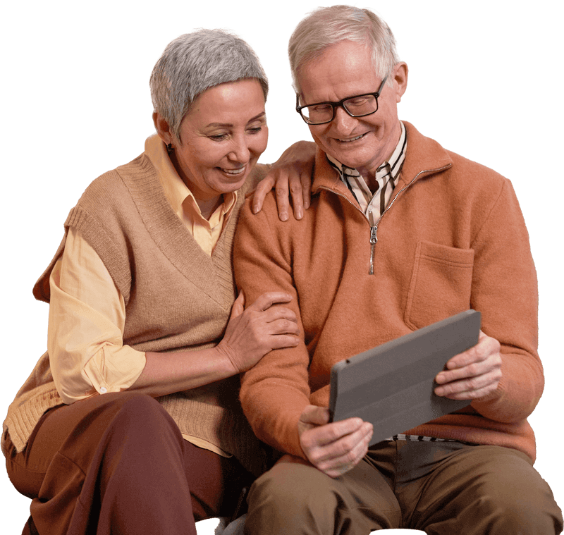 Elderly couple looking at tablet